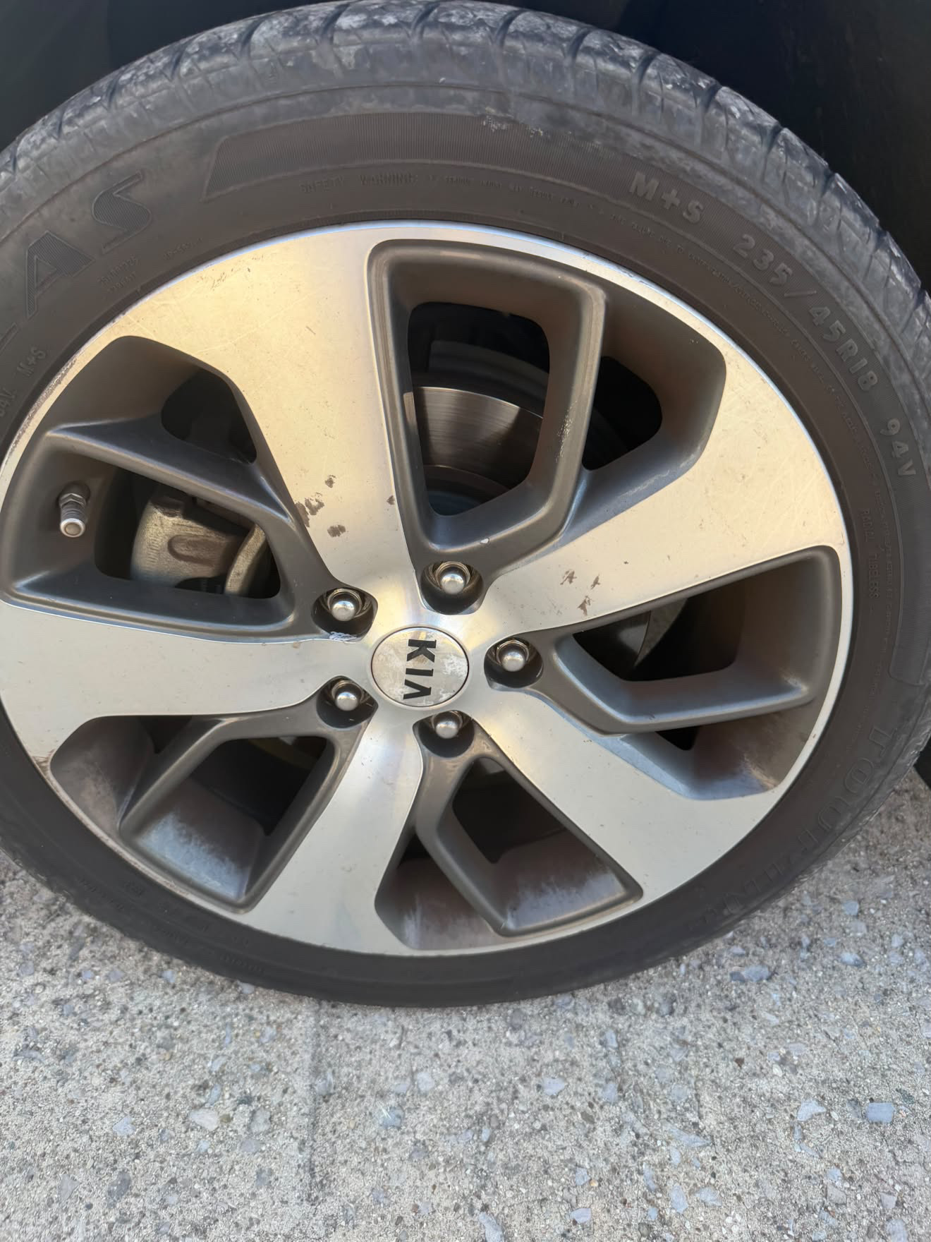 Kia wheel and tire before detailing